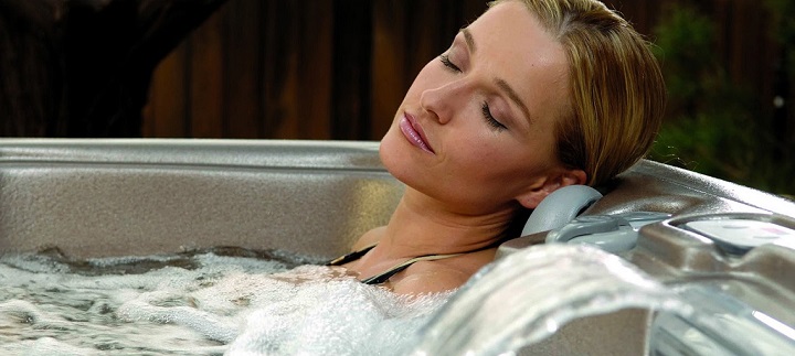 Women Relax In 4 Person Spas