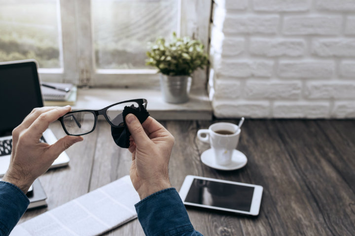 man-cleaning-glasses