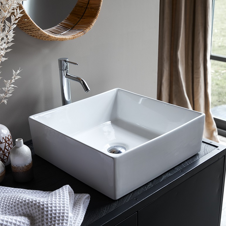 picture of a bathroom with white square ceramic basin