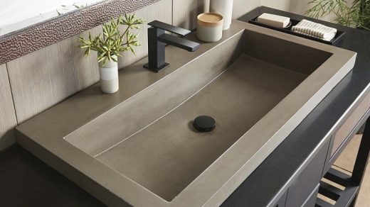 picture of a bathroom with brown tiles and dark brown vanity basin