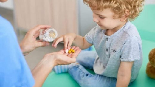 kids taking vitamins to be healthy