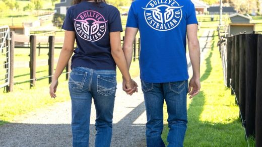 woman and man holding hands while wearing Bullzye clothes